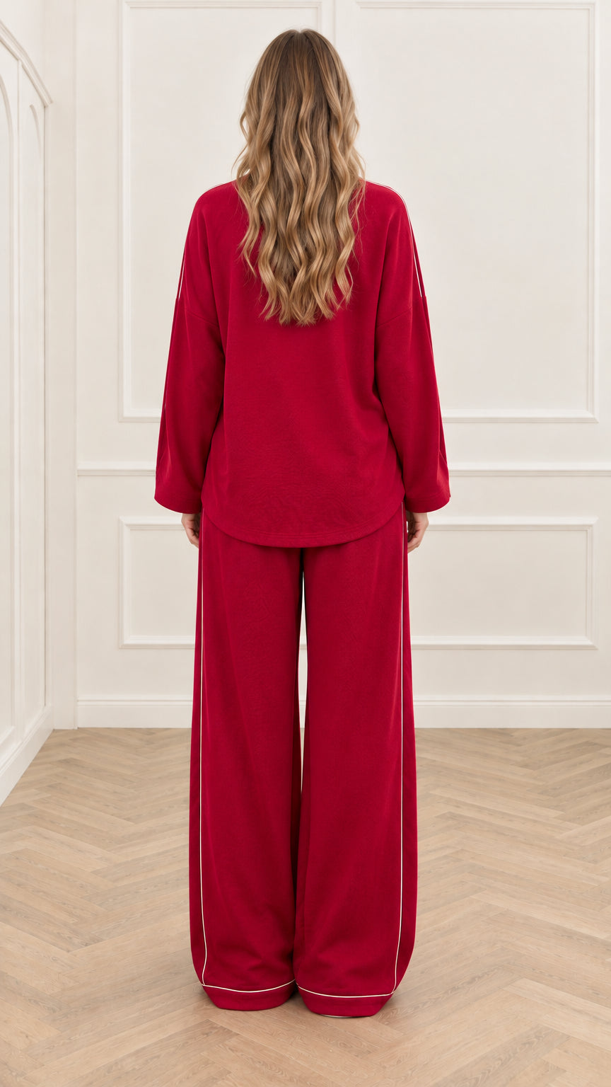 Back view of woman wearing red long sleeve top and wide leg lounge pants