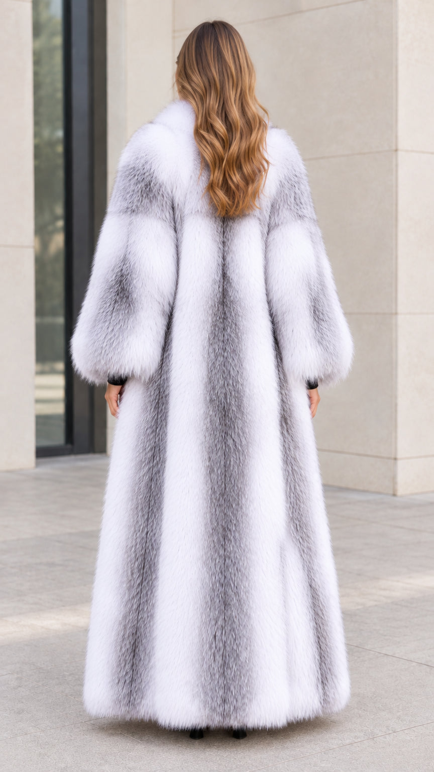 Back view of model showcasing full-length Silver White faux fur coat silhouette