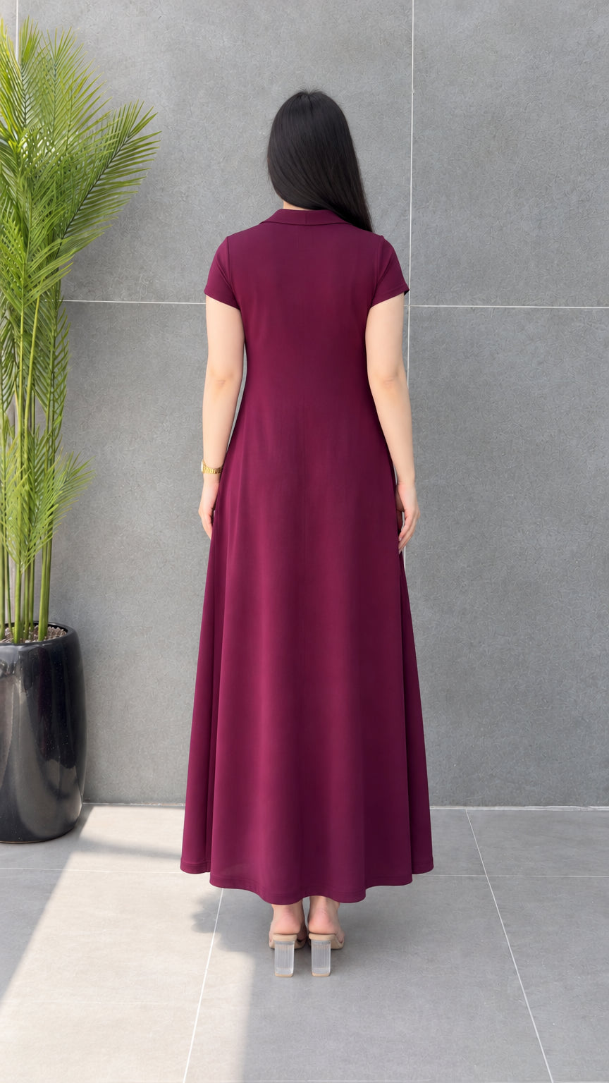 Back view of woman showing the clean silhouette of Burgundy polo collar maxi dress