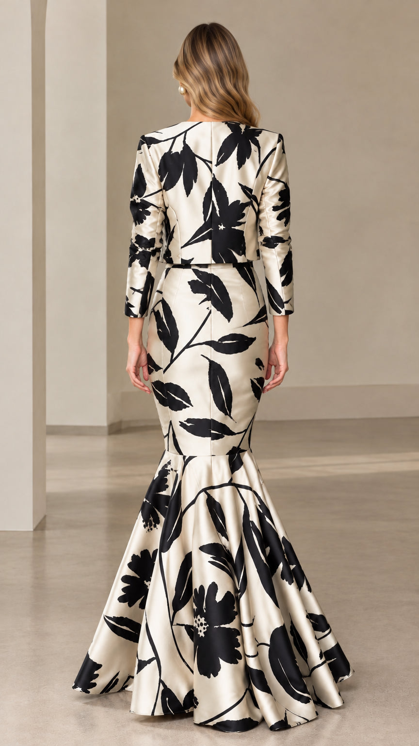 Back view of ivory and black floral tailored jacket and mermaid skirt set