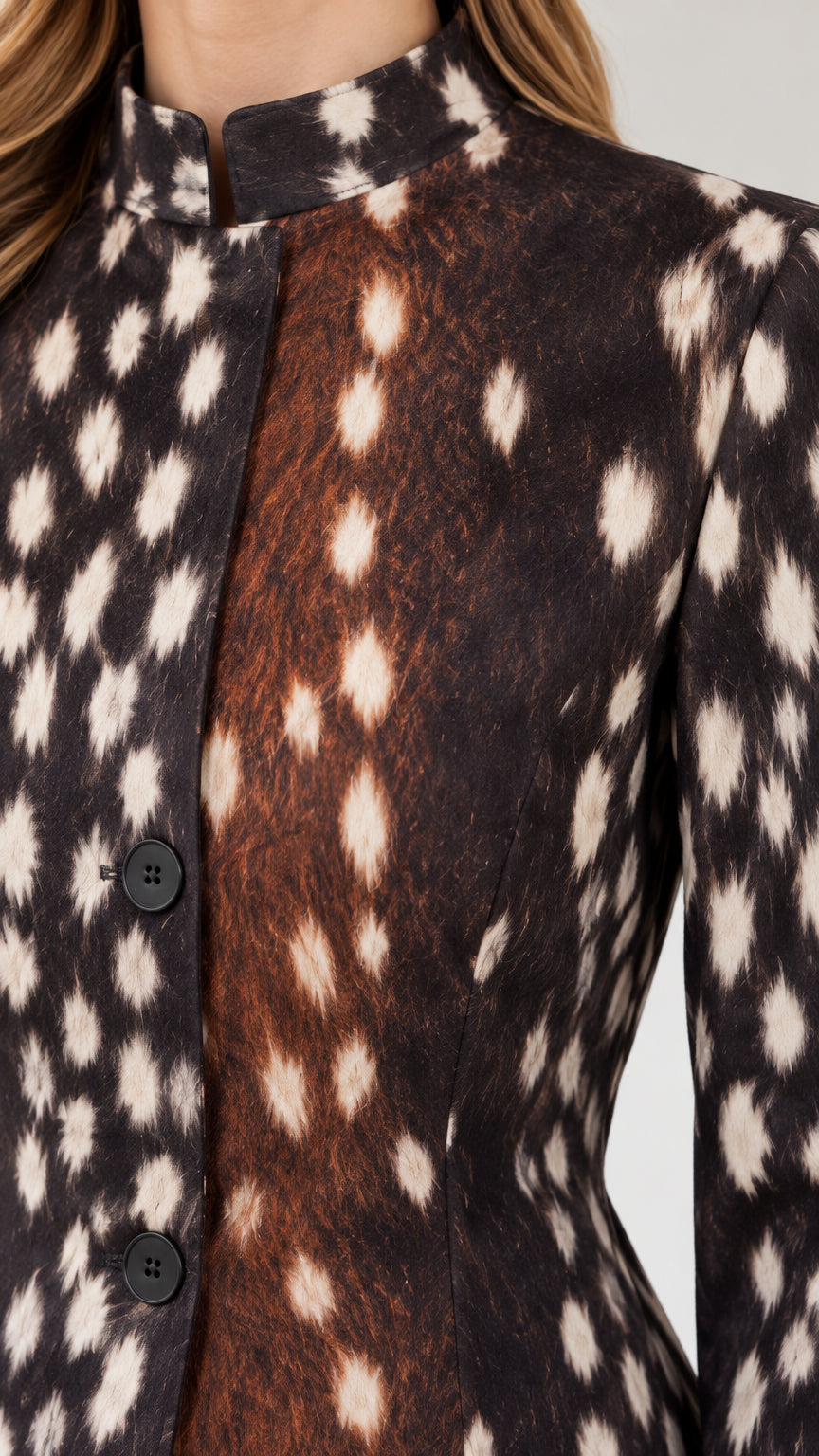 Close-up detail of stand collar and button front on brown spotted print jacket