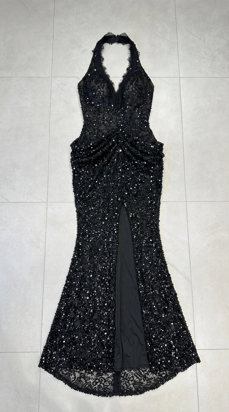 Flat lay of black halter neck embellished sequin evening dress