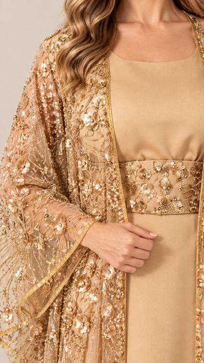 Close-up detail of floral sequin embroidery and waistband on gold formal dress