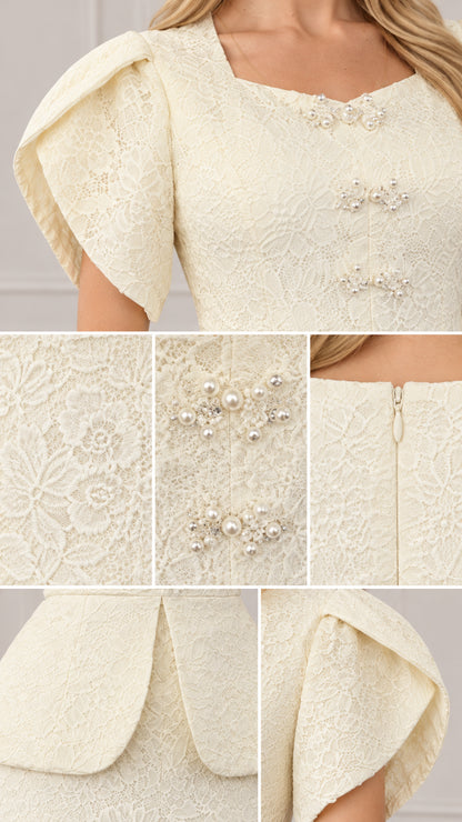 Close-up details of ivory lace texture, pearl bodice accents, and tulip sleeve structure