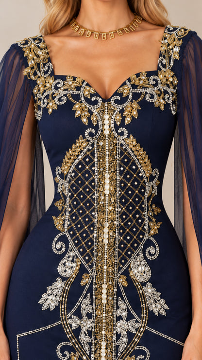 Close-up of intricate gold and silver embroidery and beading on gown neckline