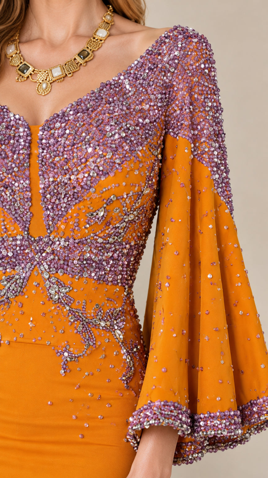 Close-up of intricate beading and sequin details on neckline and bell sleeves