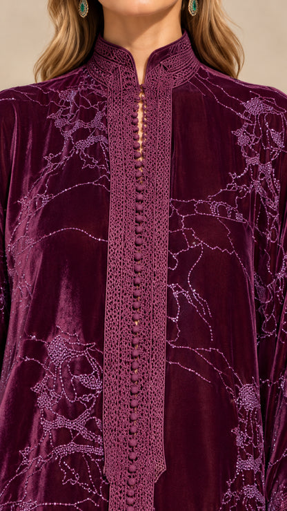 Close-up detail of mandarin collar and braided button placket on plum velvet dress