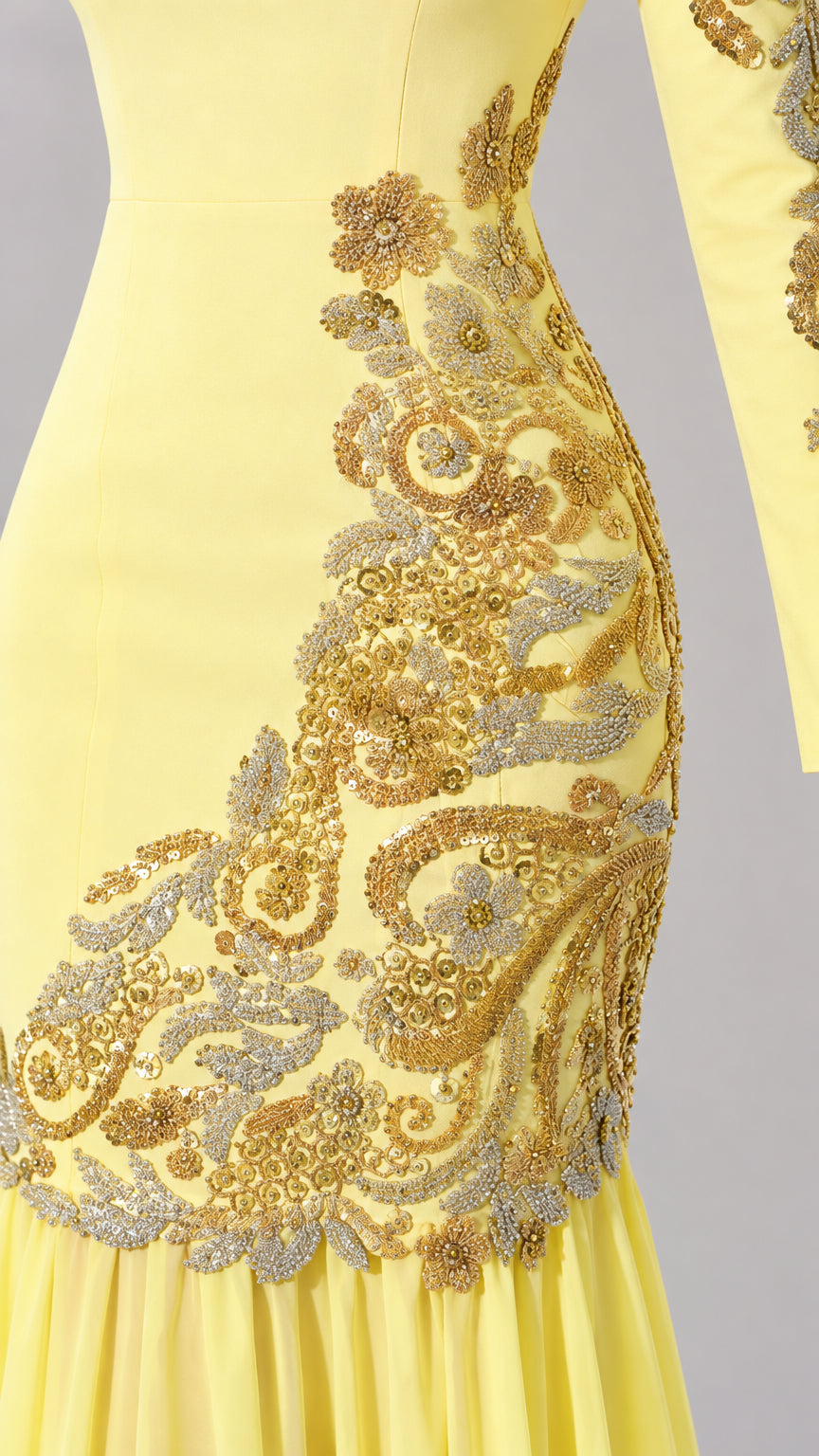 Close-up detail of metallic gold floral embroidery on the hip and waist