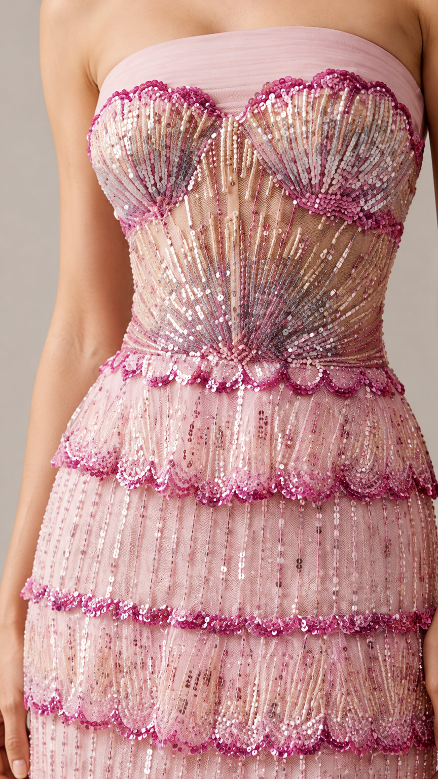 Close-up detail of blush pink beaded corset bodice and scalloped tiered sequins