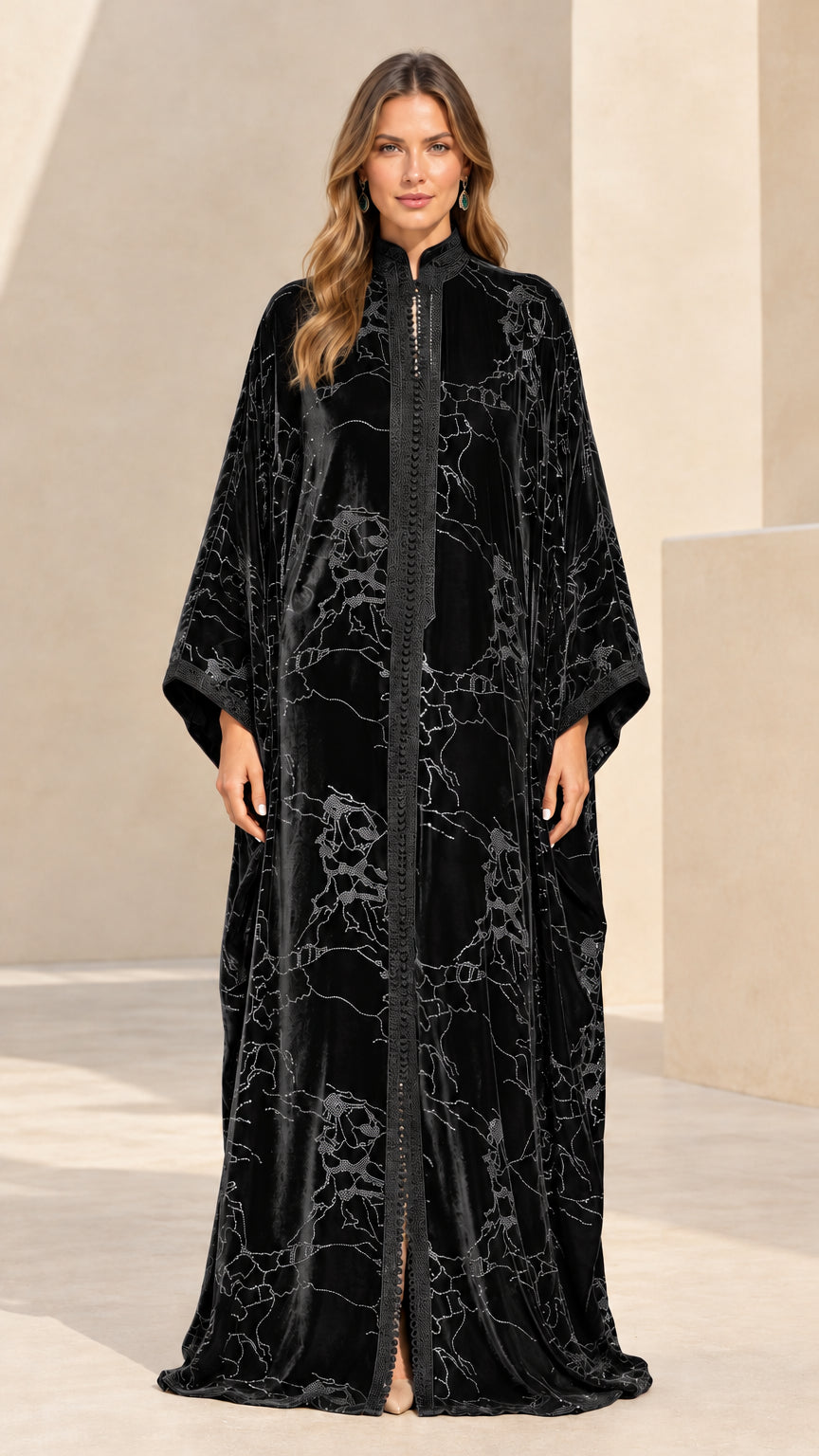 Front full-length view of black embroidered velvet maxi kaftan dress