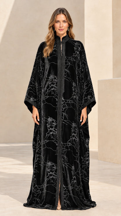 Front full-length view of black embroidered velvet maxi kaftan dress