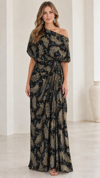 Woman wearing black one-shoulder embroidered draped maxi dress