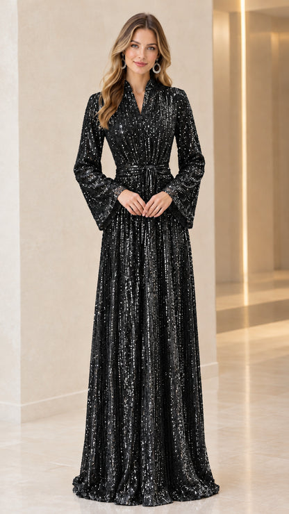 Model wearing black sequin long bell sleeve maxi dress with tie belt