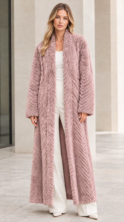 Front view of model wearing dusty rose pink chevron textured faux fur maxi coat