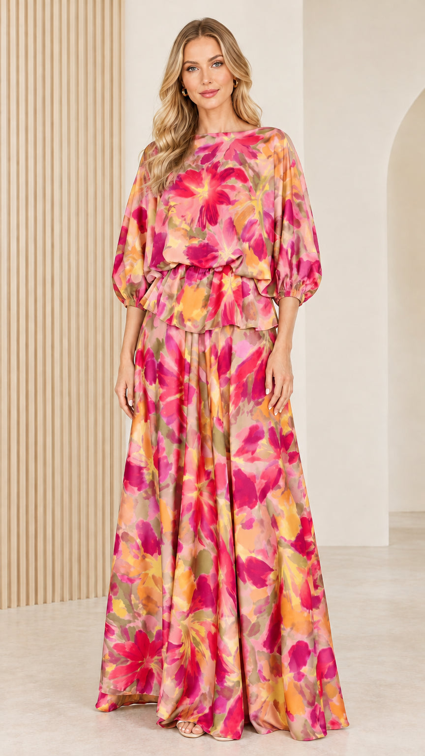 Front full view of woman wearing soft blush pink and rose floral satin maxi dress