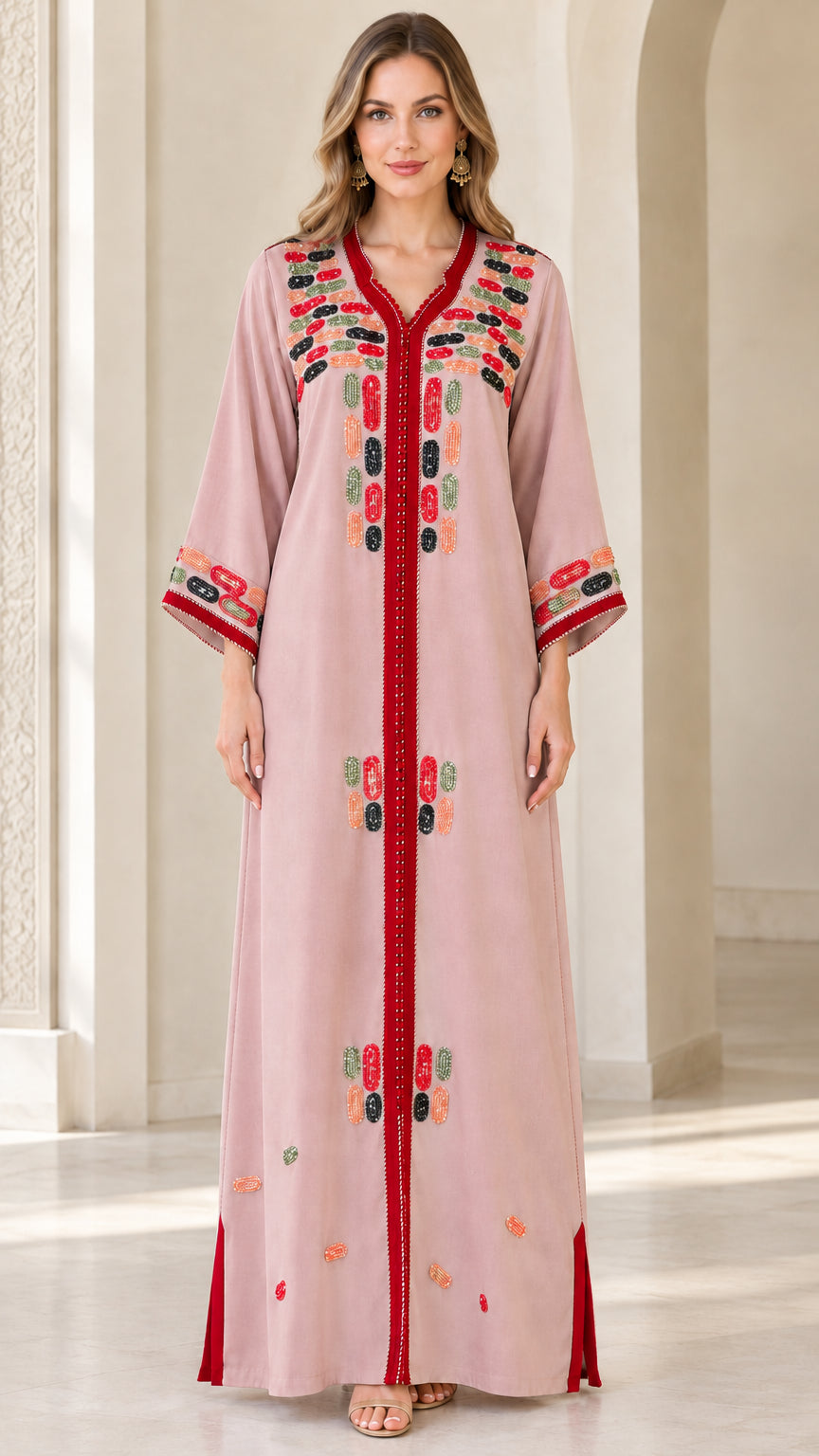 Front view of model wearing dusty pink embroidered maxi kaftan dress