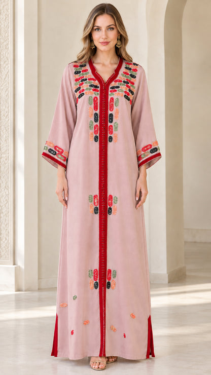 Front view of model wearing dusty pink embroidered maxi kaftan dress
