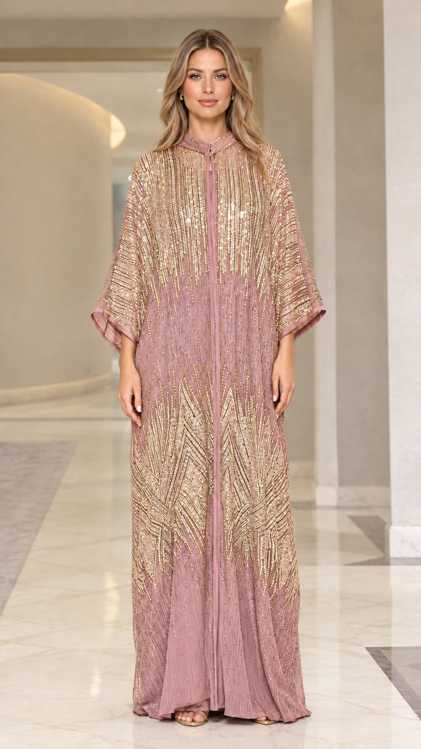 Front view of woman wearing dusty rose pink sequin kaftan maxi dress