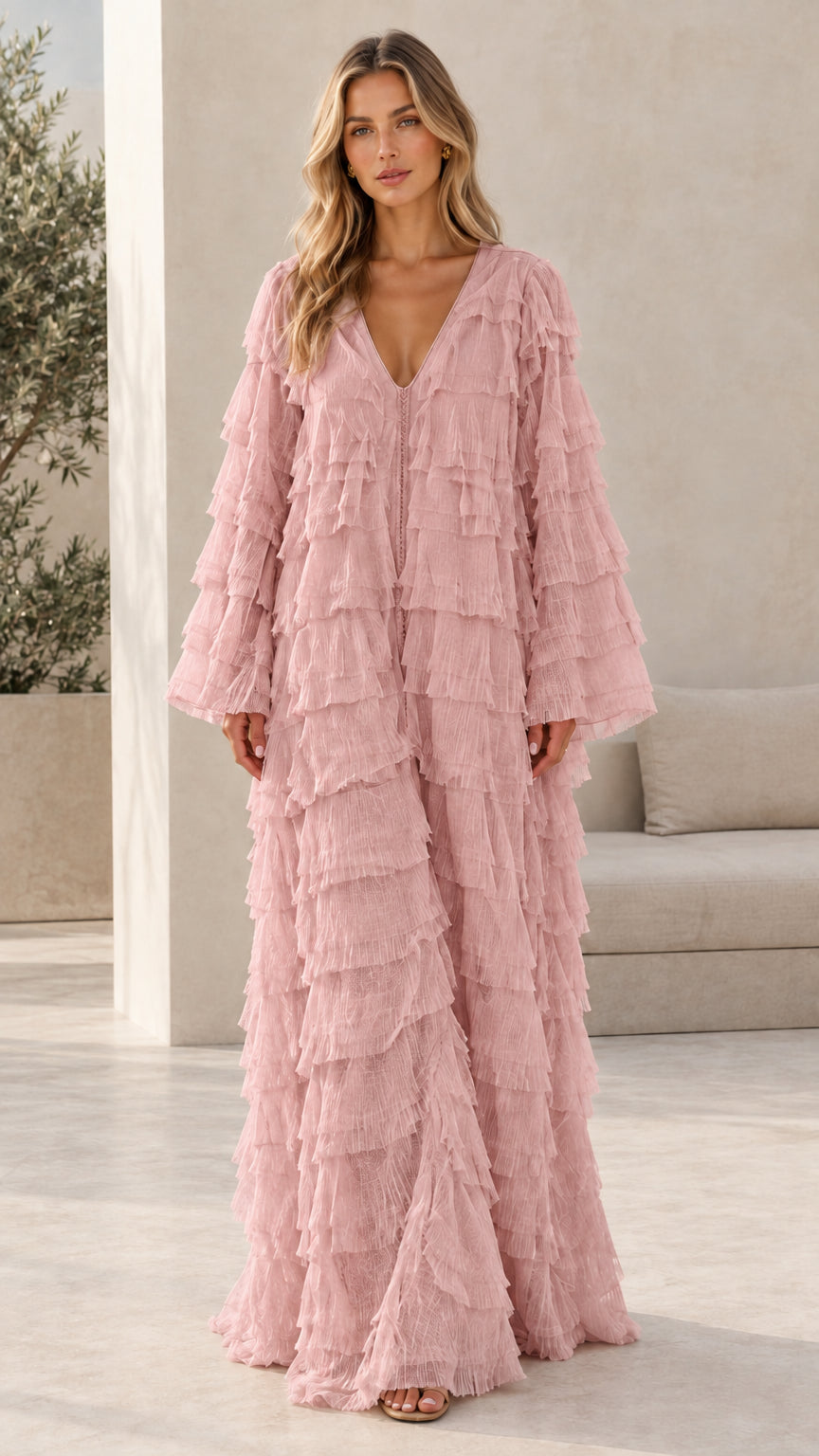 Model wearing dusty pink tiered ruffle long sleeve maxi dress