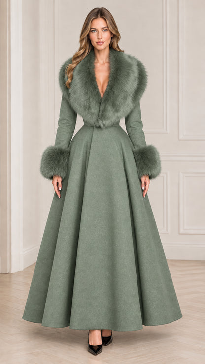 Model wearing sage green full length winter coat with faux fur collar