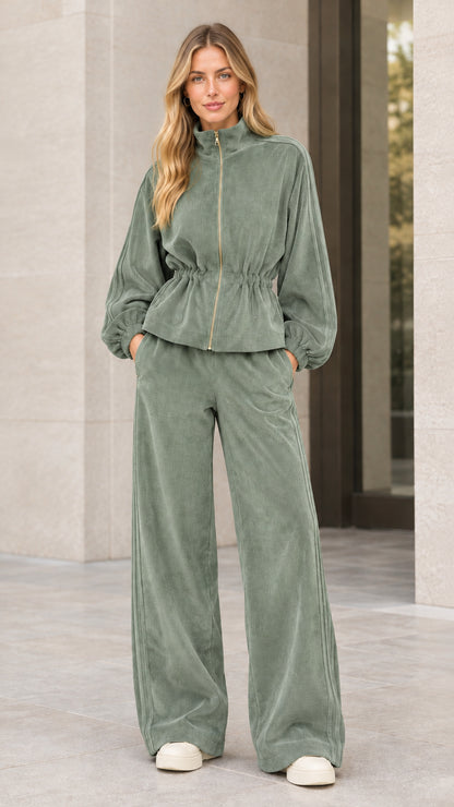 Woman wearing sage green corduroy tracksuit set with wide leg pants