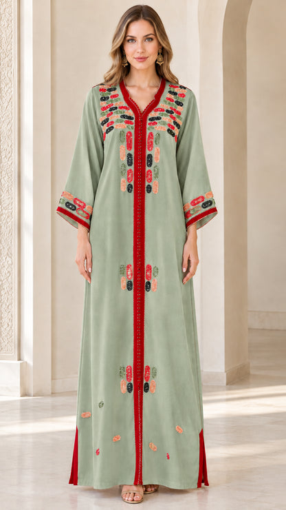 Front view of model wearing sage green embroidered maxi kaftan dress