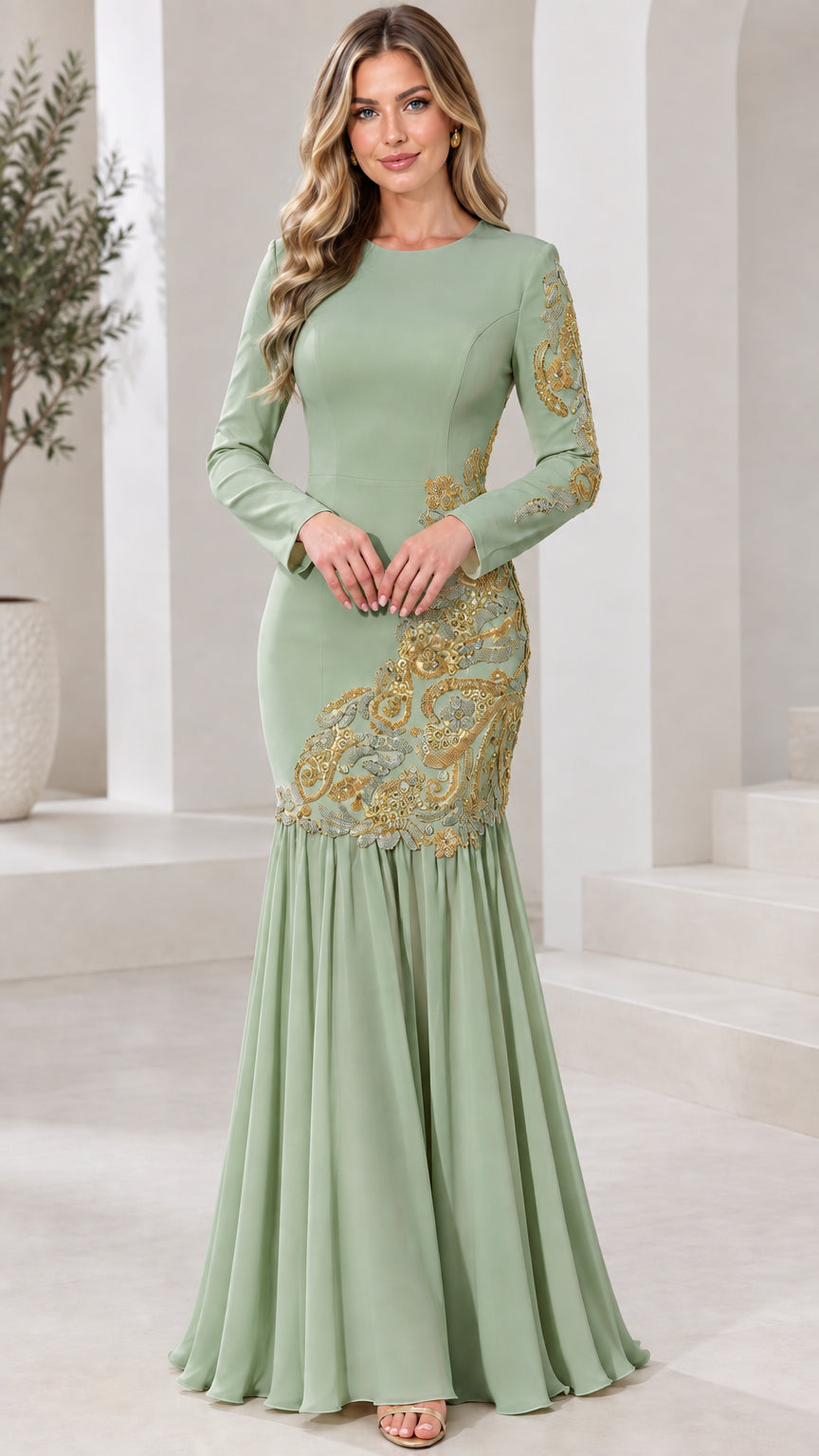 Model wearing sage green long sleeve mermaid gown with gold baroque embroidery