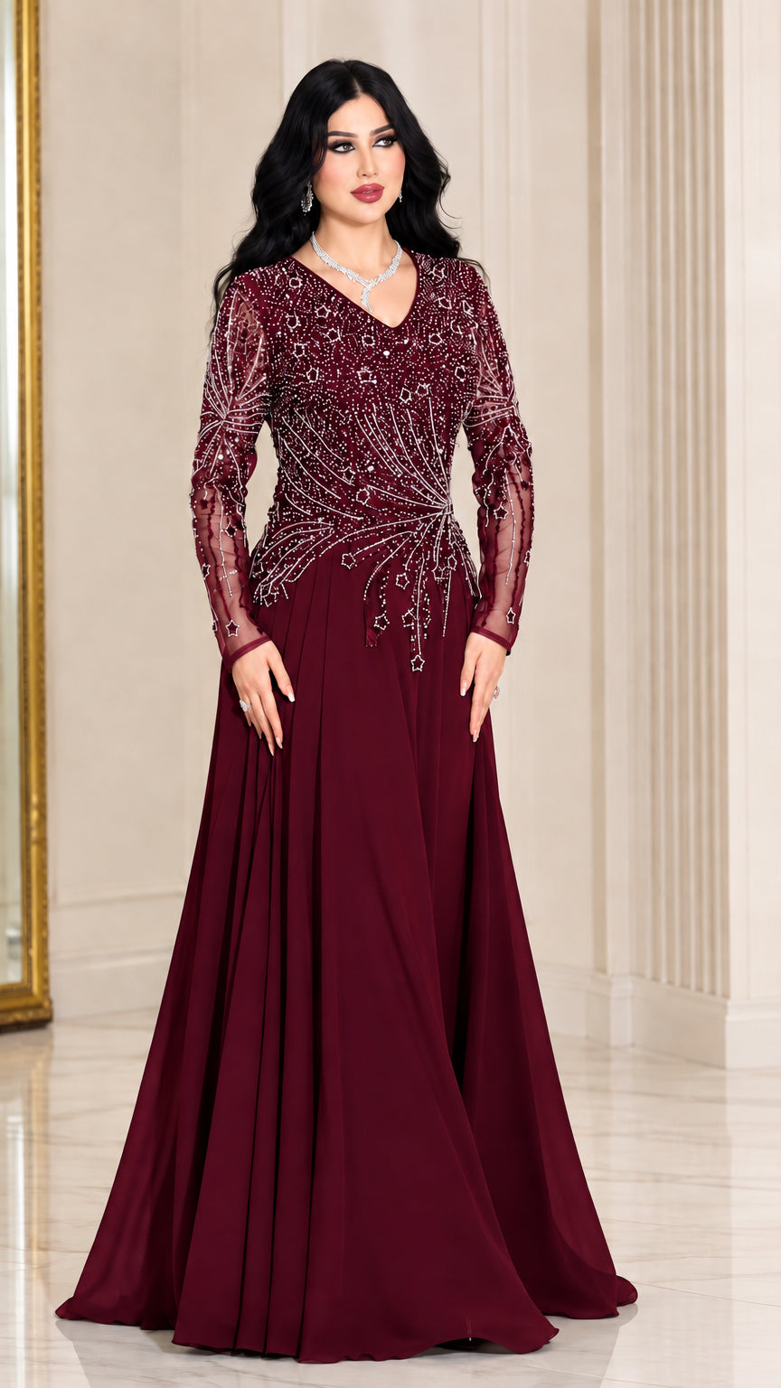 Front view of woman wearing burgundy wine red long sleeve beaded evening gown