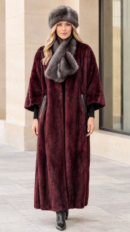 Full-length view of women's maxi faux fur coat in deep burgundy wine