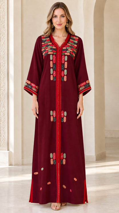 Front view of model wearing burgundy red embroidered maxi kaftan dress