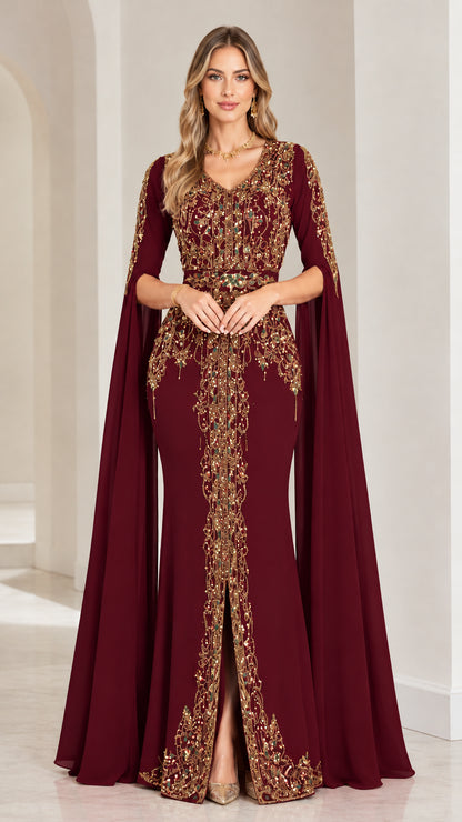 Full front view of burgundy wine cape sleeve evening gown with gold embroidery