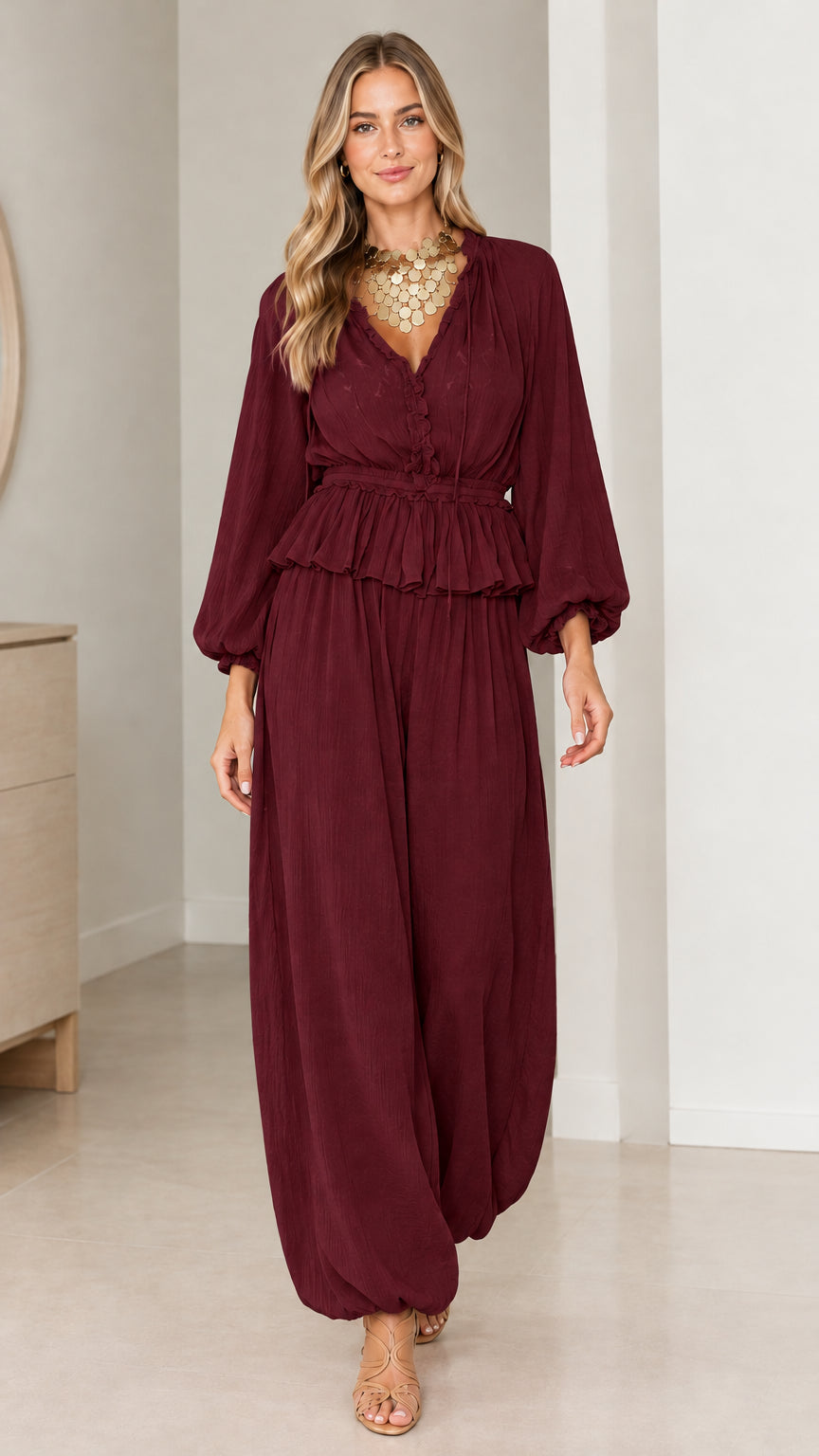 Model wearing Burgundy matching peplum top and loose-fit trousers set