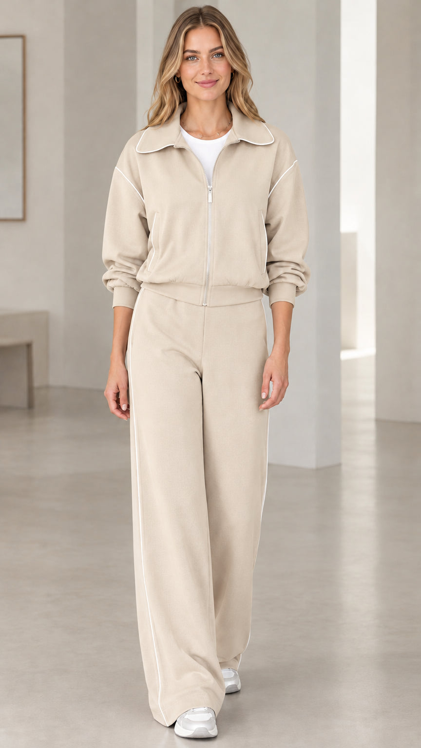 Front view of model wearing Beige oatmeal two-piece zip jacket and wide-leg pants set