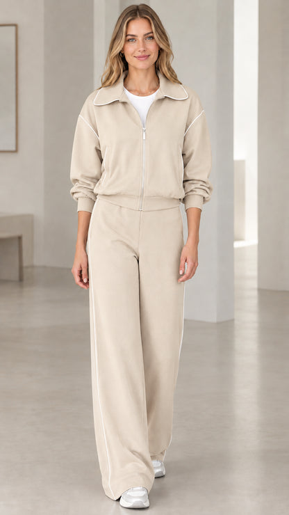Front view of model wearing Beige oatmeal two-piece zip jacket and wide-leg pants set