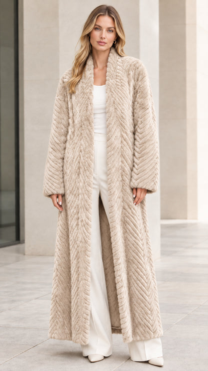 Front view of model wearing beige cream chevron textured faux fur maxi coat