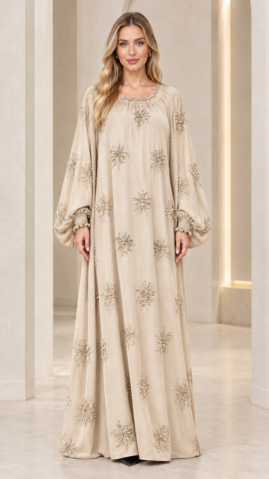 Full-length front view of model wearing champagne beige beaded kaftan maxi dress